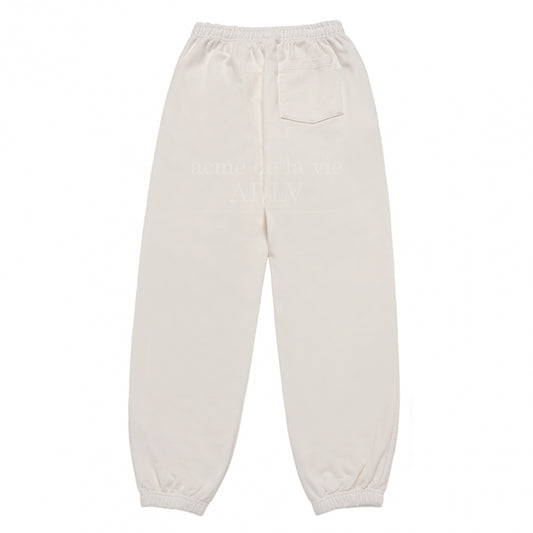 [acmé de la vie X HOSHI]  ROUND SCRIPT BOUCLE LOGO PANTS CREAM